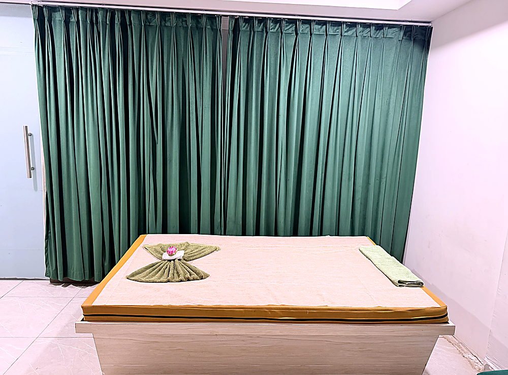 Therapy bed with fresh linens at Vaayu Wellness Spa, Gachibowli