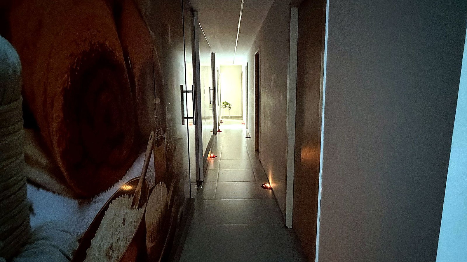 Candle-lit corridor at Vaayu Wellness Spa